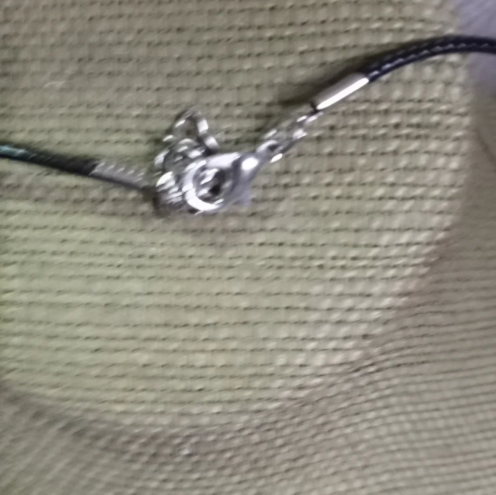 Silvertone crystal Premier designs pendant on black cord
